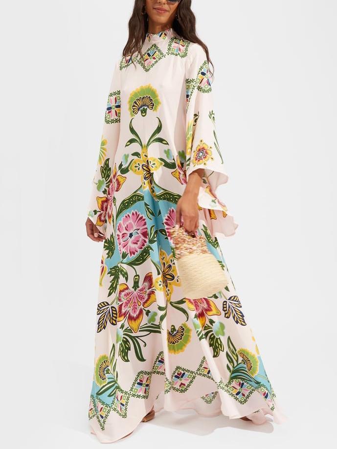 Elegant women's floral long sleeve maxi dress in cream, perfect for spring/summer occasions. Flowy and stylish.