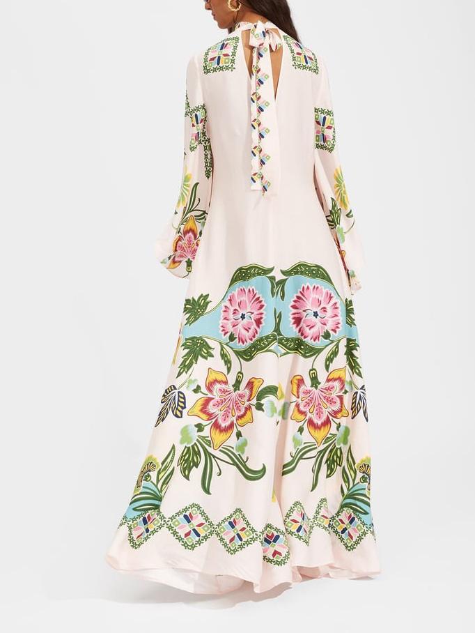Cream floral maxi dress for women with long sleeves, offering versatile, elegant fashion for day or evening wear.