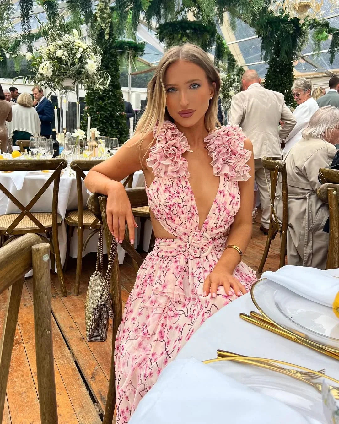 V-neck floral maxi dress with elegant ruffles & daring cut-outs, perfect for summer events.