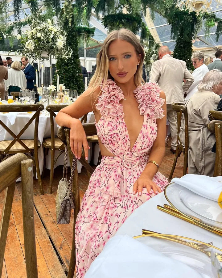 V-neck floral maxi dress with elegant ruffles & daring cut-outs, perfect for summer events.