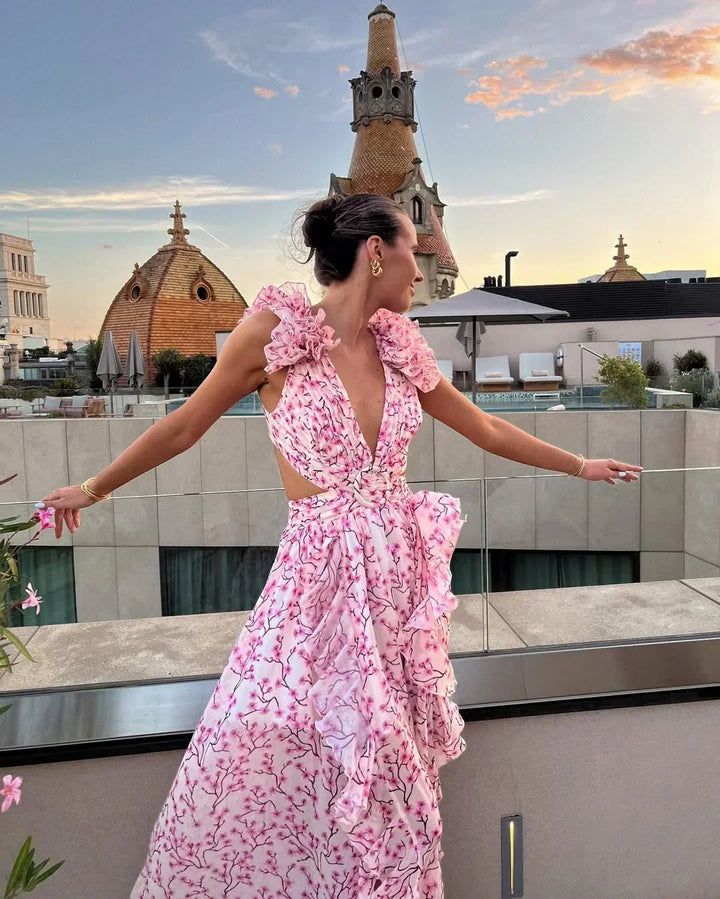 Fashionable women's floral maxi dress, sleeveless, v-neck, ruffles, & alluring cut-out.