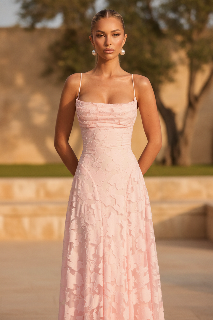 Elegant women's floral maxi dress with spaghetti straps for summer occasions.
