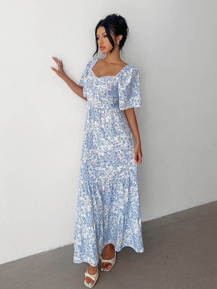 Sweetheart tiered floral maxi dress for women, perfect for elegant summer events or stylish casual outfits.