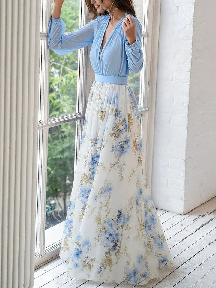 Comfortable women's floral print maxi dress featuring a V-neck and stylish long flowing sleeves for spring.