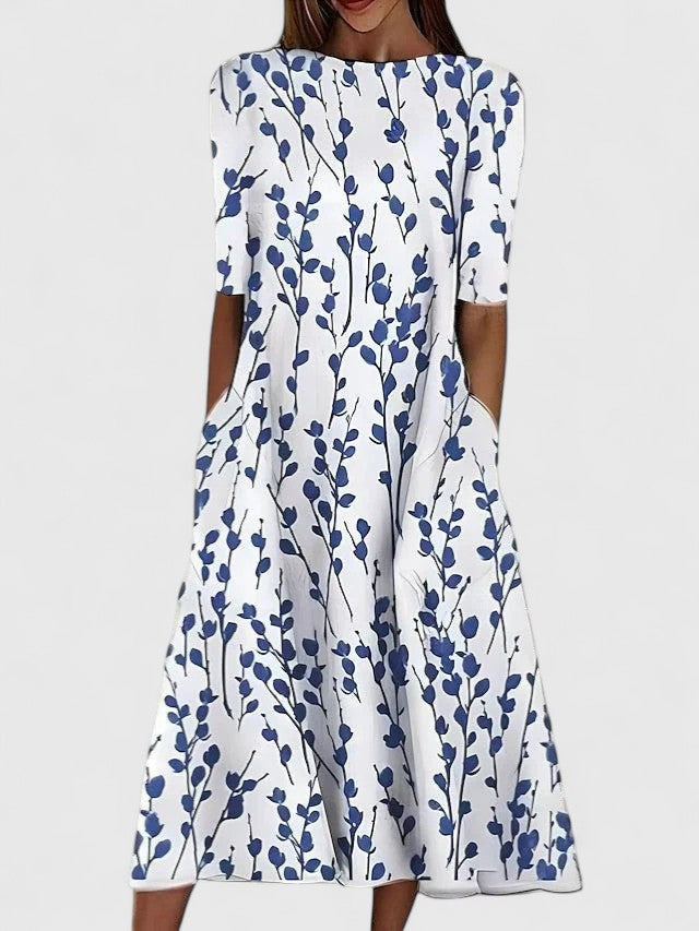 Elegant women's floral midi dress for summer, featuring a flowy silhouette & round neck, perfect for vacation or casual wear.