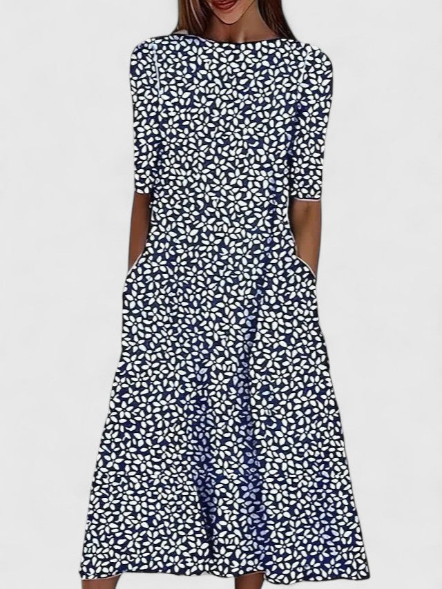 Stylish women's floral midi dress, designed for summer comfort. Flowy, round neck, great for casual wear & vacation.