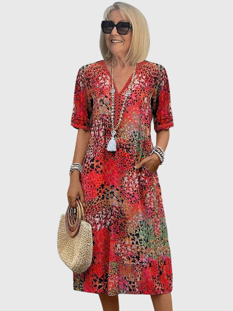 Flattering floral midi dress for women, ideal for elegant summer parties or casual spring wear.