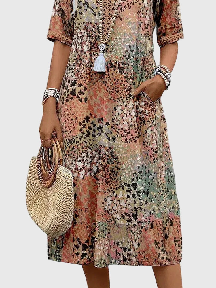 Women's elegant floral midi dress. Comfortable, flowy design perfect for spring & summer fashion and versatile events.