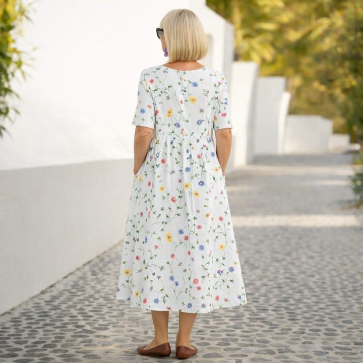 Flowy & versatile women's floral midi dress, chic for summer events.