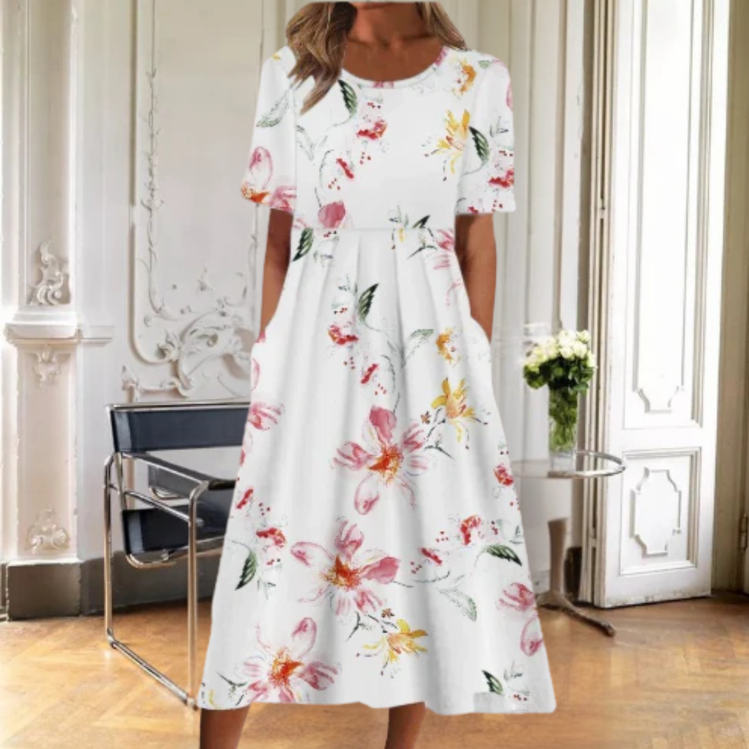 Elegant women's floral midi dress with short sleeves, flowy a-line design, perfect for sophisticated daytime wear.