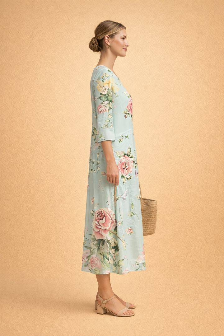 Ladies' elegant floral print midi dress, featuring three-quarter sleeves and a round neck for summer comfort.