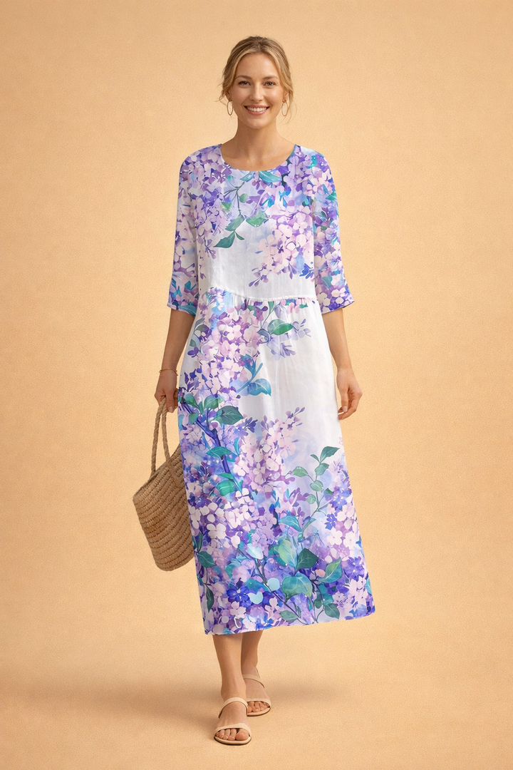 Relaxed fit floral midi dress for women, perfect for comfortable summer style. Elegant and versatile design.