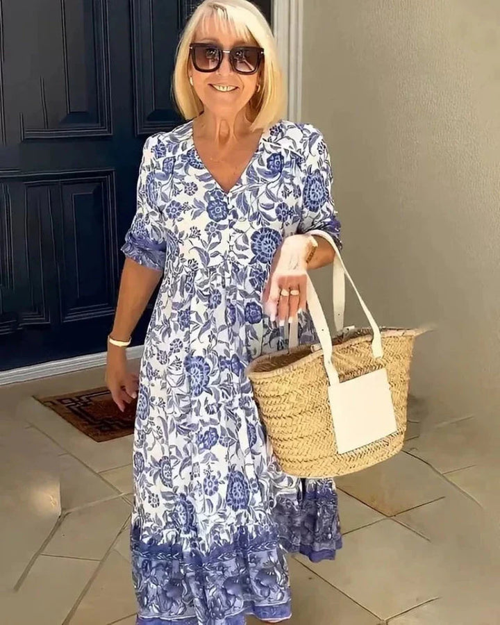 Elegant women's floral midi dress with a flattering V-neck, perfect for spring/summer occasions.