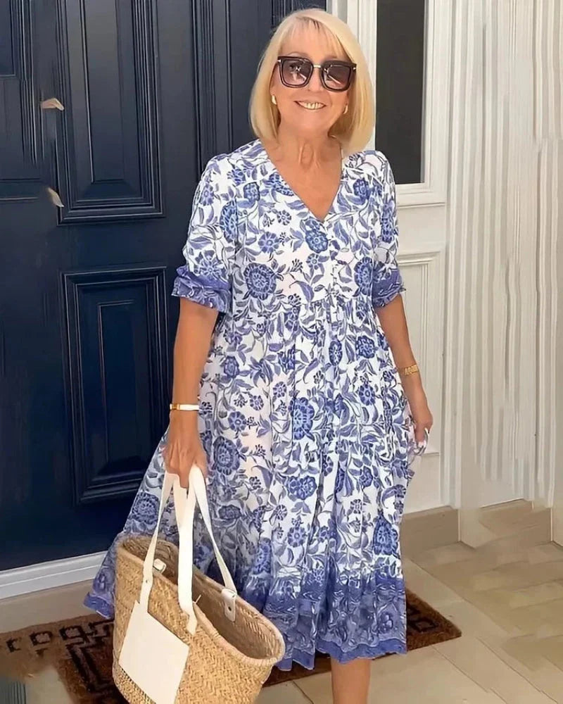 Airy boho-chic floral midi dress for women, featuring a comfortable V-neck, ideal for summer fashion.