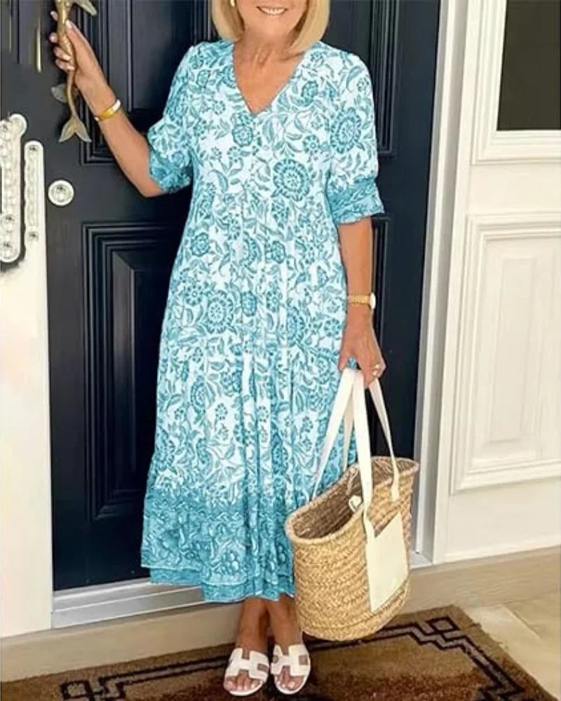 Women's elegant A-line floral midi dress with a V-neck, suitable for occasion wear & warm weather.