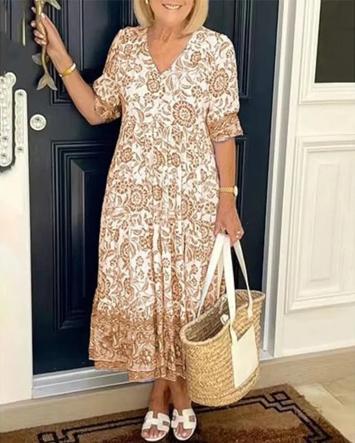 Beautiful women's floral print midi dress with a flattering V-neckline, embodying elegant summer fashion.