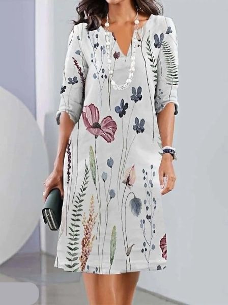 Versatile A-line floral midi dress for women, featuring short sleeves and a round neck, ideal for casual elegance.