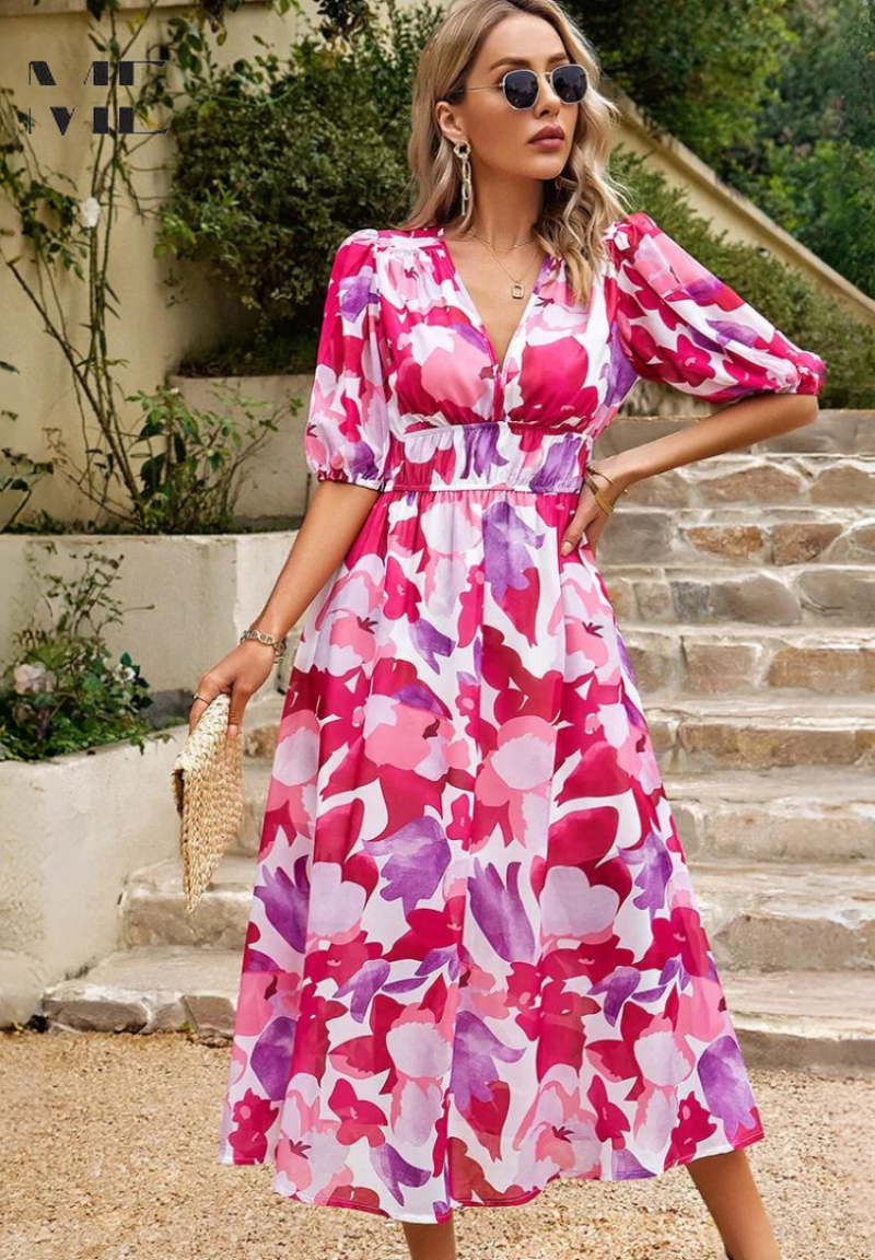 Vibrant floral midi dress for women, featuring elegant puff sleeves and a flattering cut.