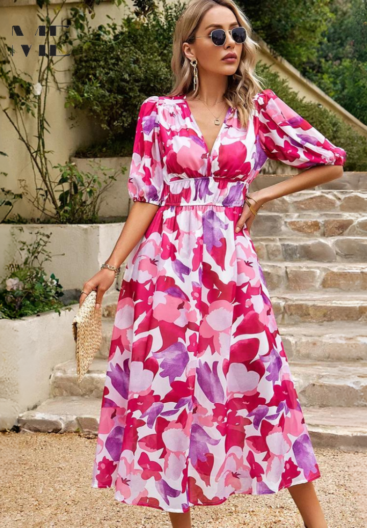 Vibrant floral midi dress for women, featuring elegant puff sleeves and a flattering cut.