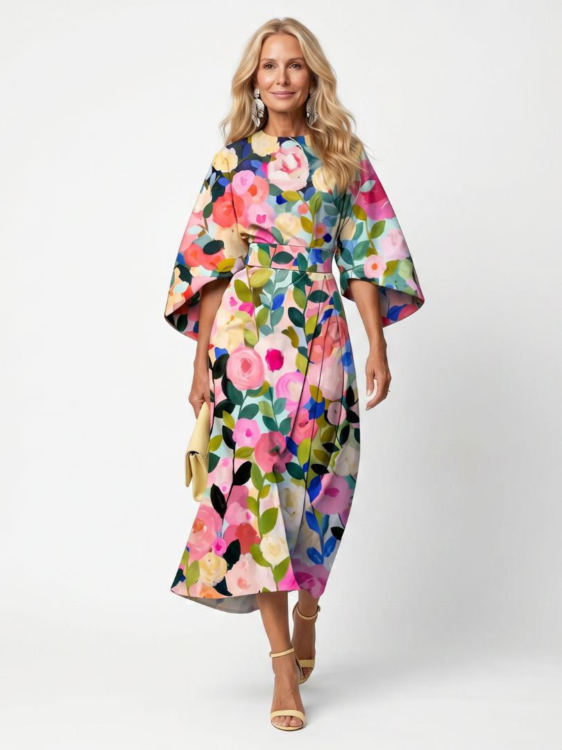 Stylish woman in an elegant floral midi dress, featuring wide sleeves & wrap waist, suitable for occasions.