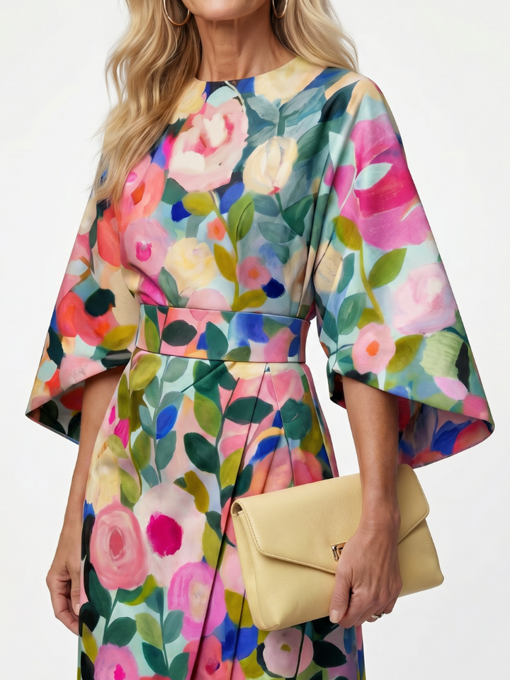 Chic & comfortable women's floral midi dress with elegant wide sleeves, round neck, and flattering wrap waist.
