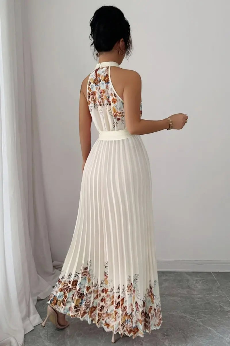 Floor-length women's floral pleated halter-neck maxi gown, a graceful option for any occasion.