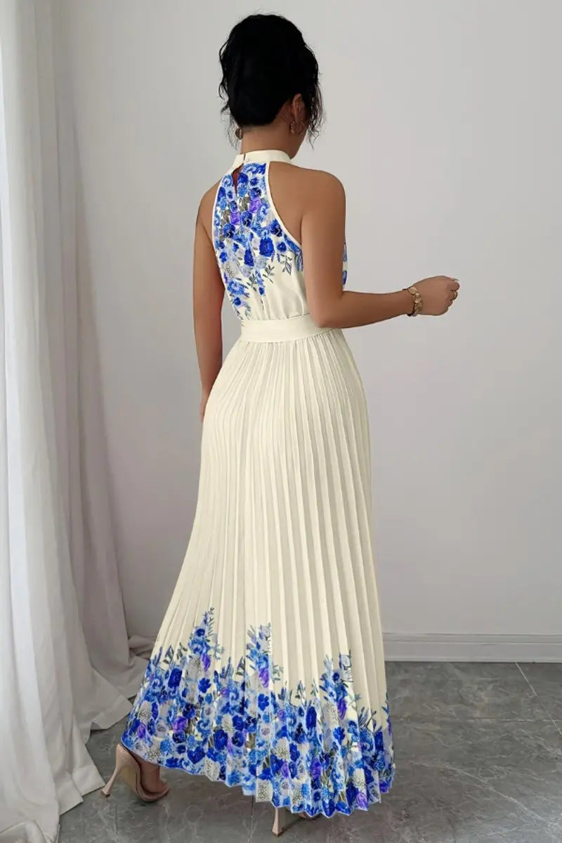 Dynamic shot: Flowing floral pleated halter-neck maxi gown, ideal for dancing at evening parties.