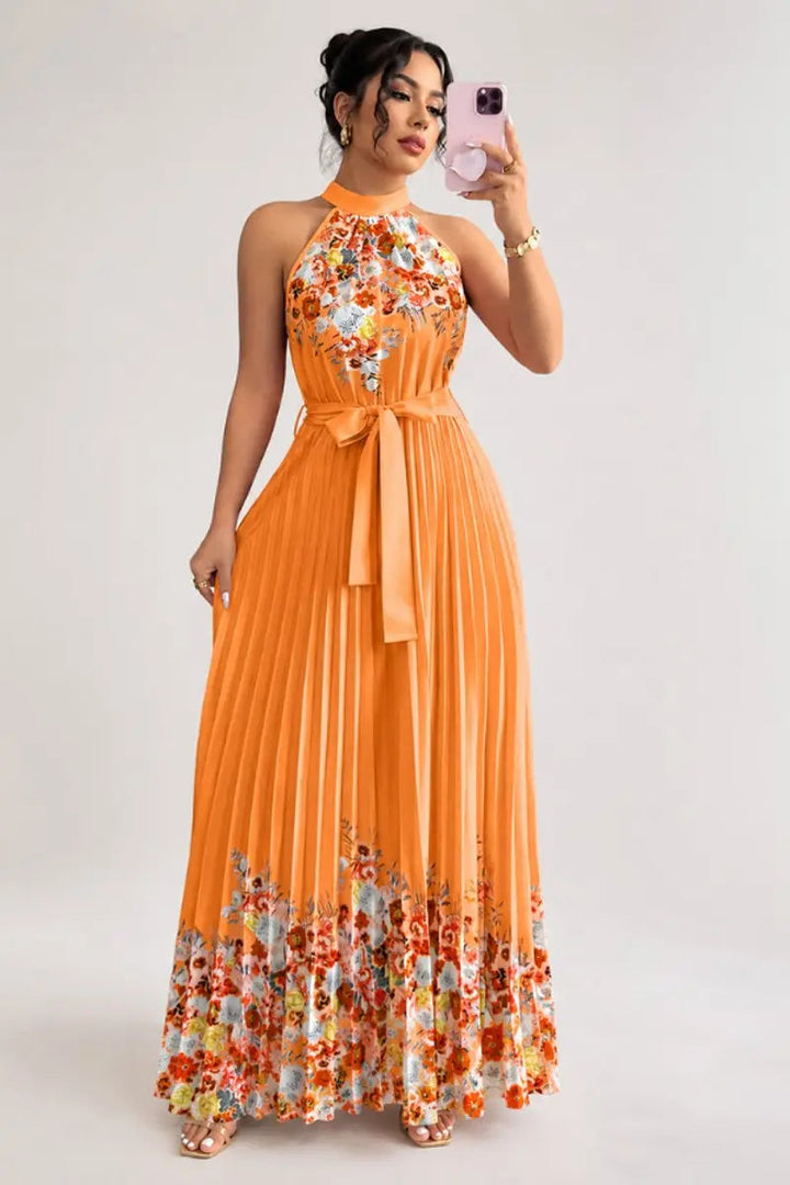 Chic women's floral pleated halter-neck maxi gown, ideal for evening events & wedding receptions.