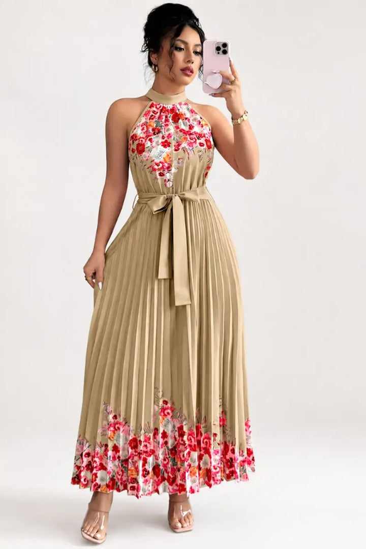 Women's floral pleated halter-neck maxi gown, perfect for outdoor summer parties & garden events.