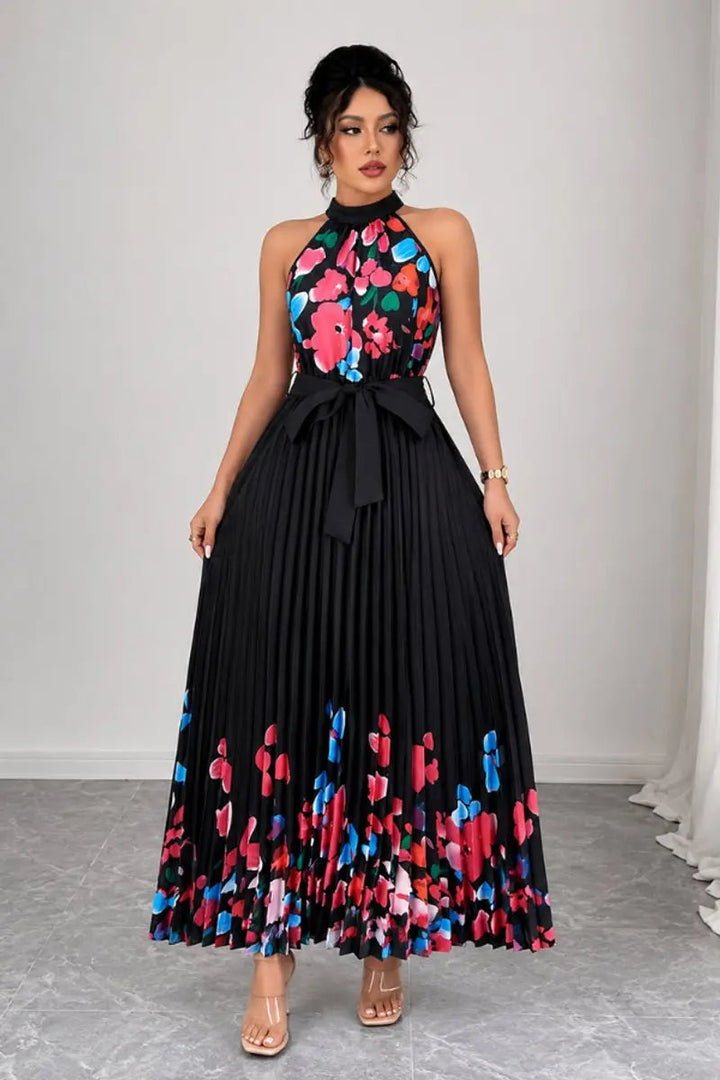 Comfortable flowing floral pleated halter-neck maxi gown for women, perfect for all-day elegance.