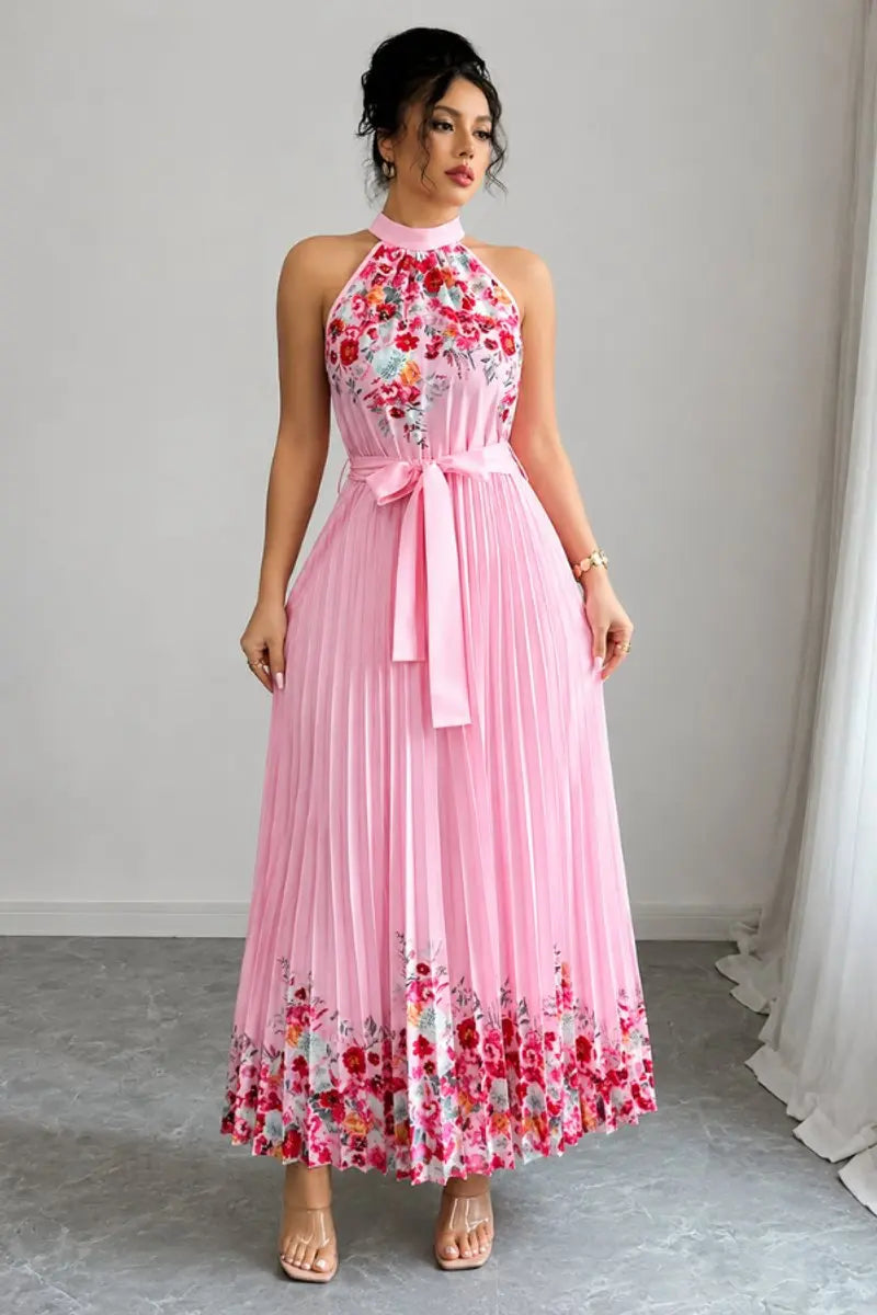 Flowing women's floral pleated halter maxi gown, ideal for wedding guests & formal events.