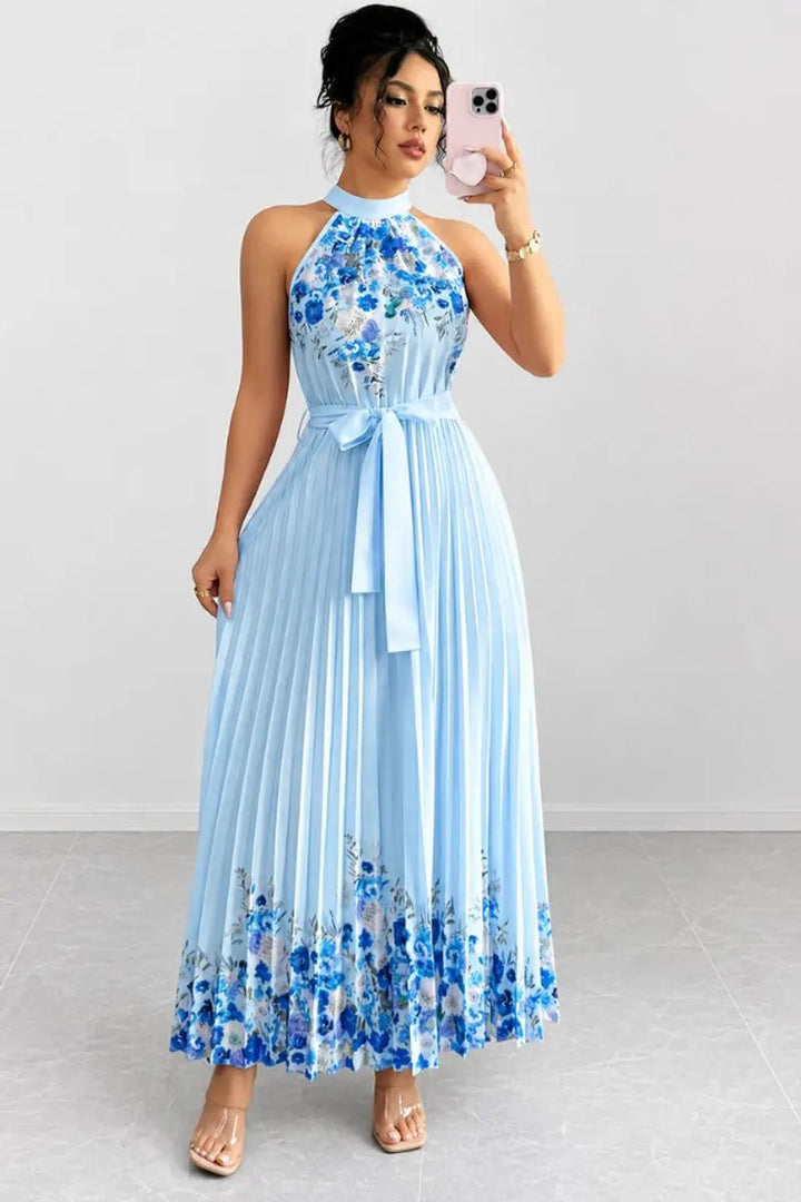 Graceful floral pleated halter-neck maxi dress with elegant design, perfect for evening wear.