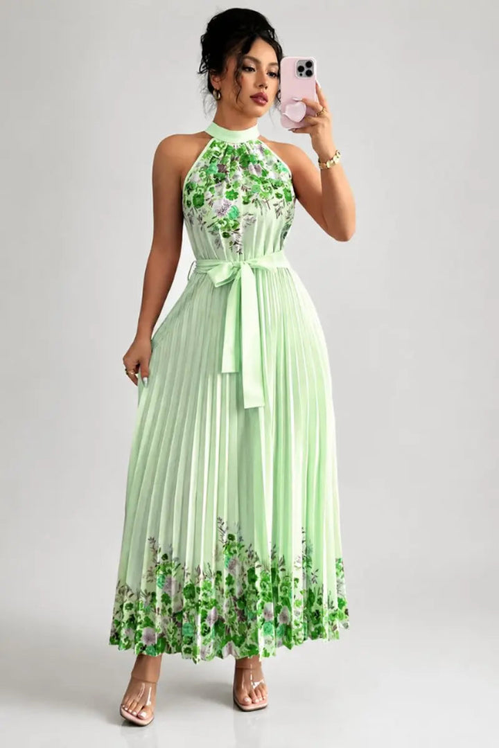 Vibrant floral print halter-neck pleated maxi dress, perfect for spring occasions & party wear.