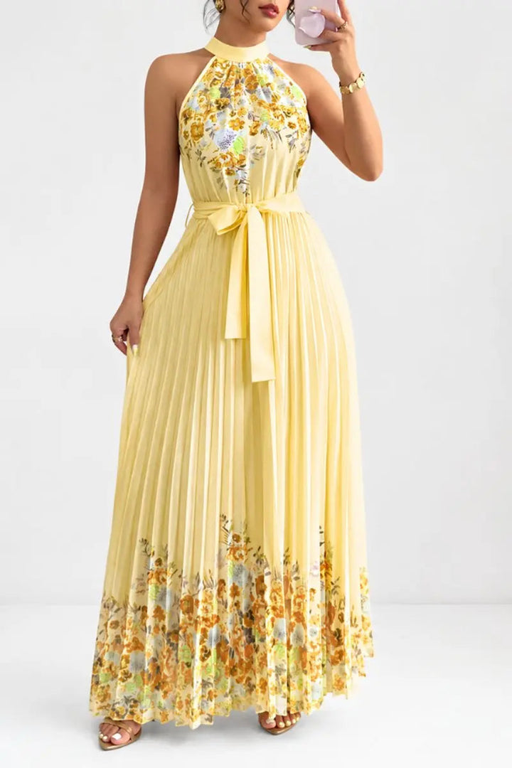 Luxurious floral pleated halter-neck maxi dress, perfect for elegant evening wear & special occasions.