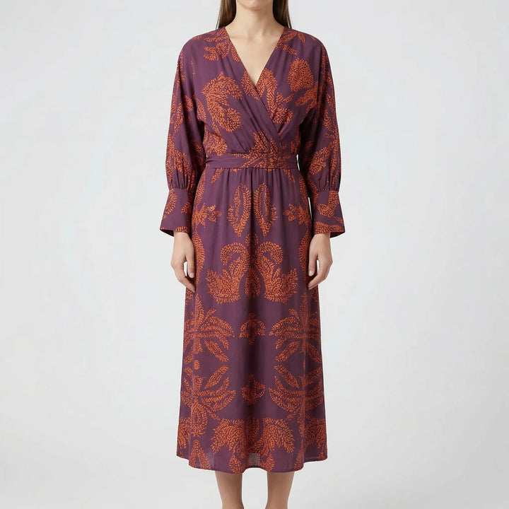 Full length view of a beautiful floral midi dress for women, an elegant A-line style suitable for evening wear.