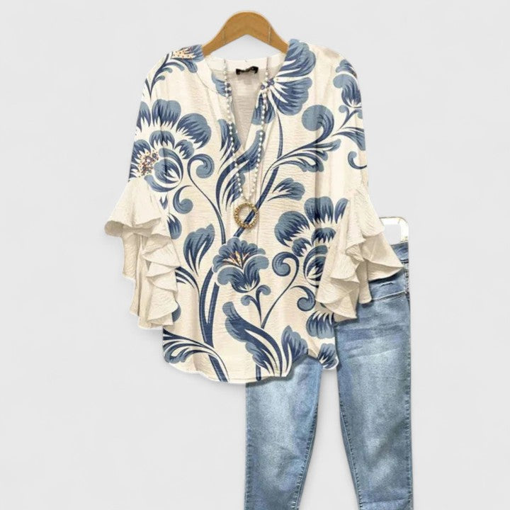 Elegant women's floral print blouse with chic ruffle long sleeves. Perfect for spring & summer fashion.