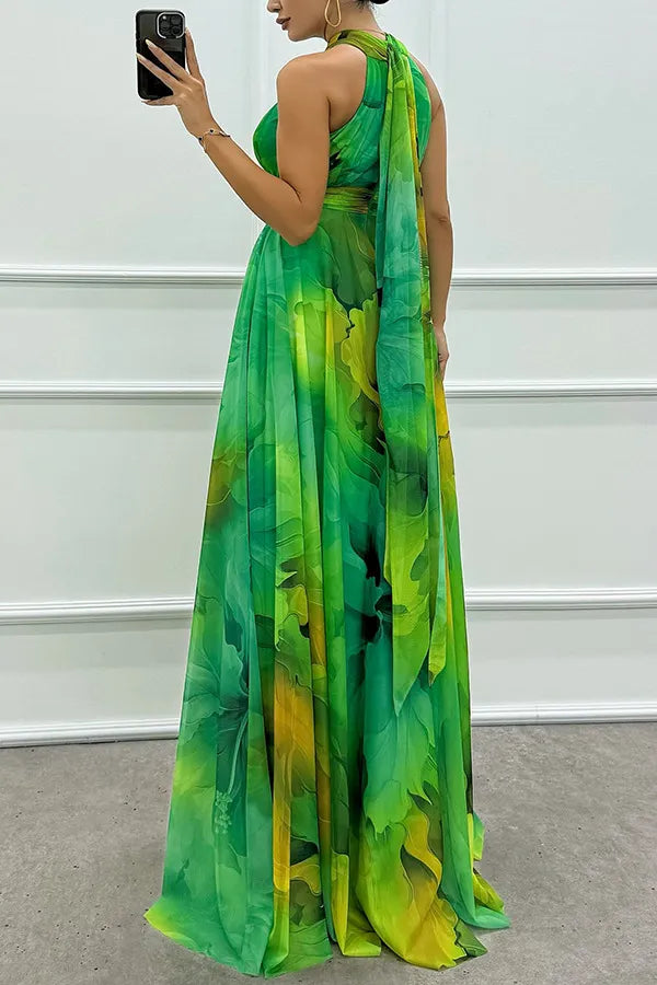 Green Floral Print Halter Maxi Dress for women with elegant waist cutouts & tie neck. Ideal for spring fashion.