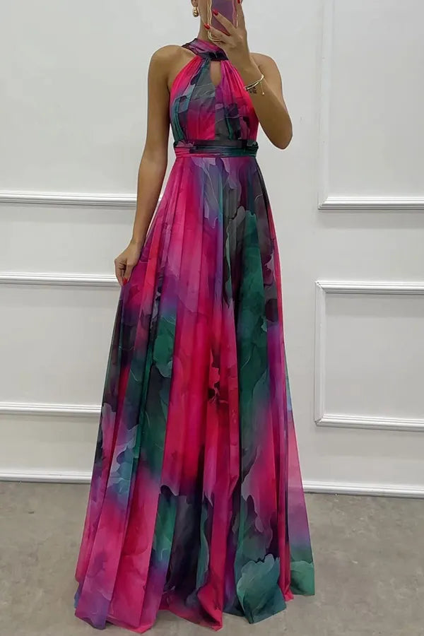 Orange Floral Print Halter Neck Maxi Dress for women, featuring chic cutouts. Perfect for summer events & garden parties.