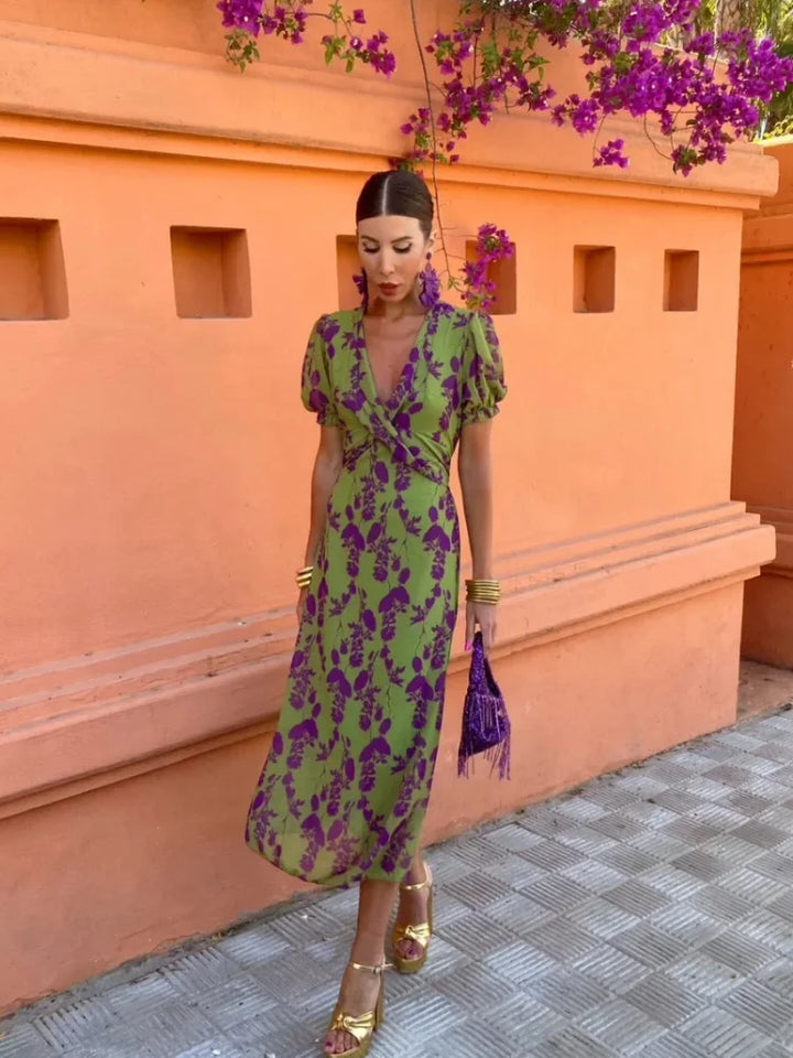 Feminine women's wrap maxi dress, featuring a delicate floral print, V-neck, and short sleeves for summer elegance.