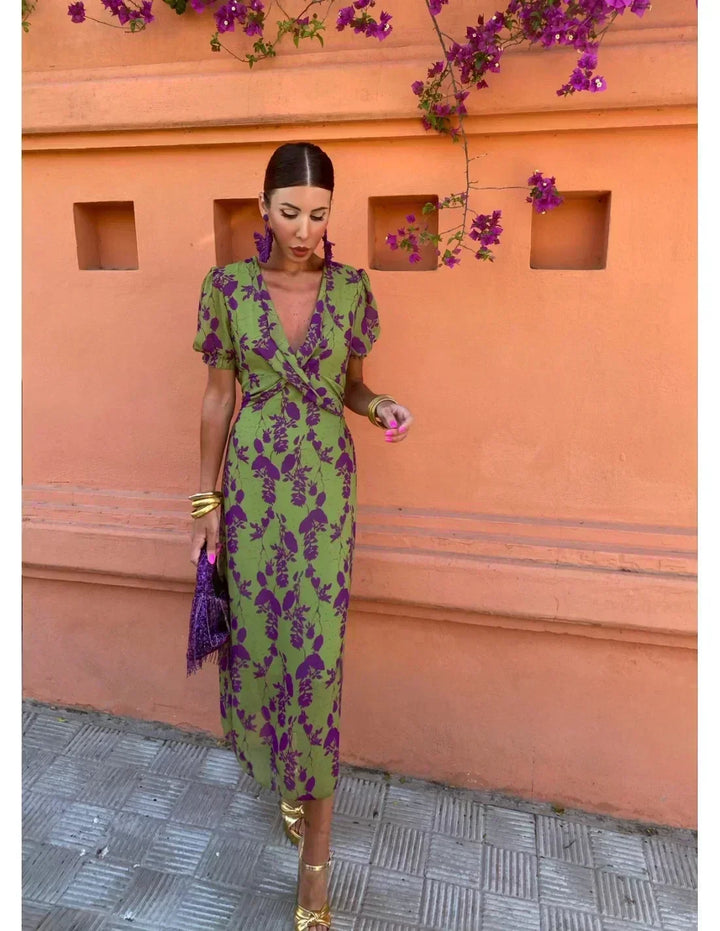 Flowy women's floral print maxi dress, an elegant V-neck design with short sleeves, perfect for summer fashion.