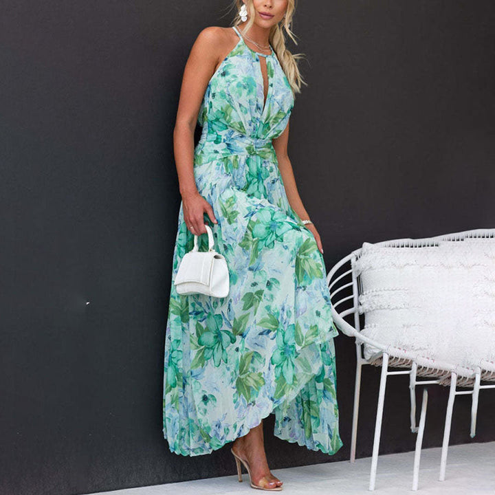 Close-up of elegant women's halter neck maxi dress with vibrant floral print, ideal for summer.