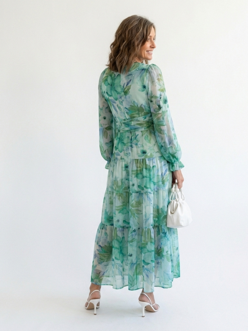 Flowy women's floral print maxi dress with long sleeves, offering elegant style and comfort.