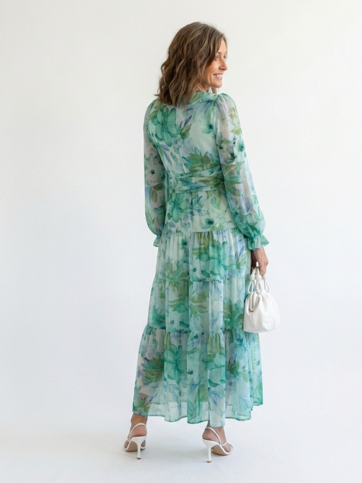 Flowy women's floral print maxi dress with long sleeves, offering elegant style and comfort.
