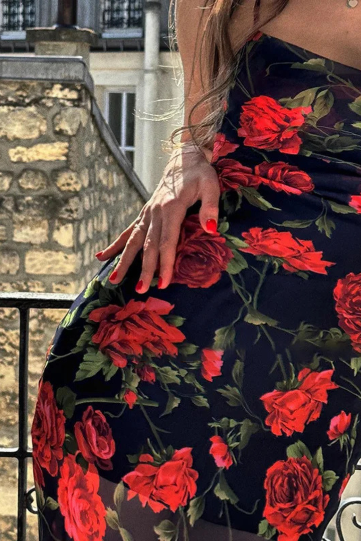 Striking floral print maxi dress for women, featuring delicate spaghetti straps, an elegant summer wardrobe essential.