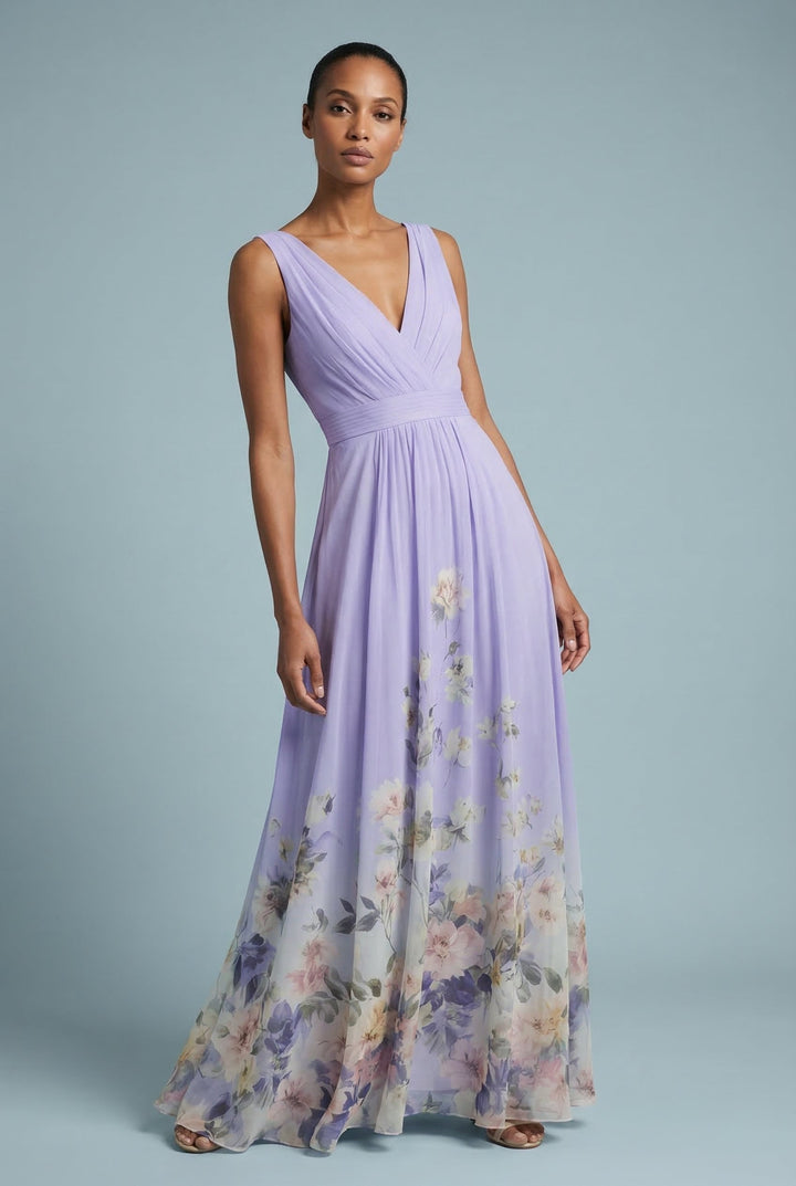 Elegant v-neck maxi dress with a romantic floral pattern and empire waist silhouette.