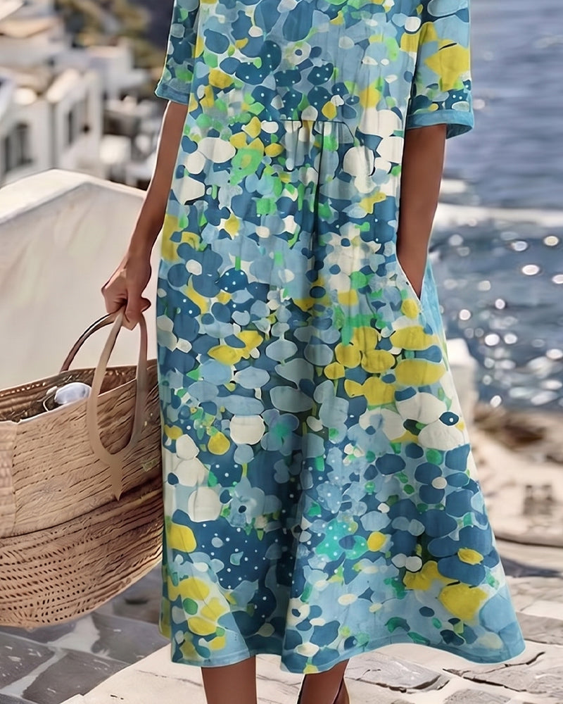 Women's casual elegant floral midi dress with pockets, round neck, perfect for summer days.
