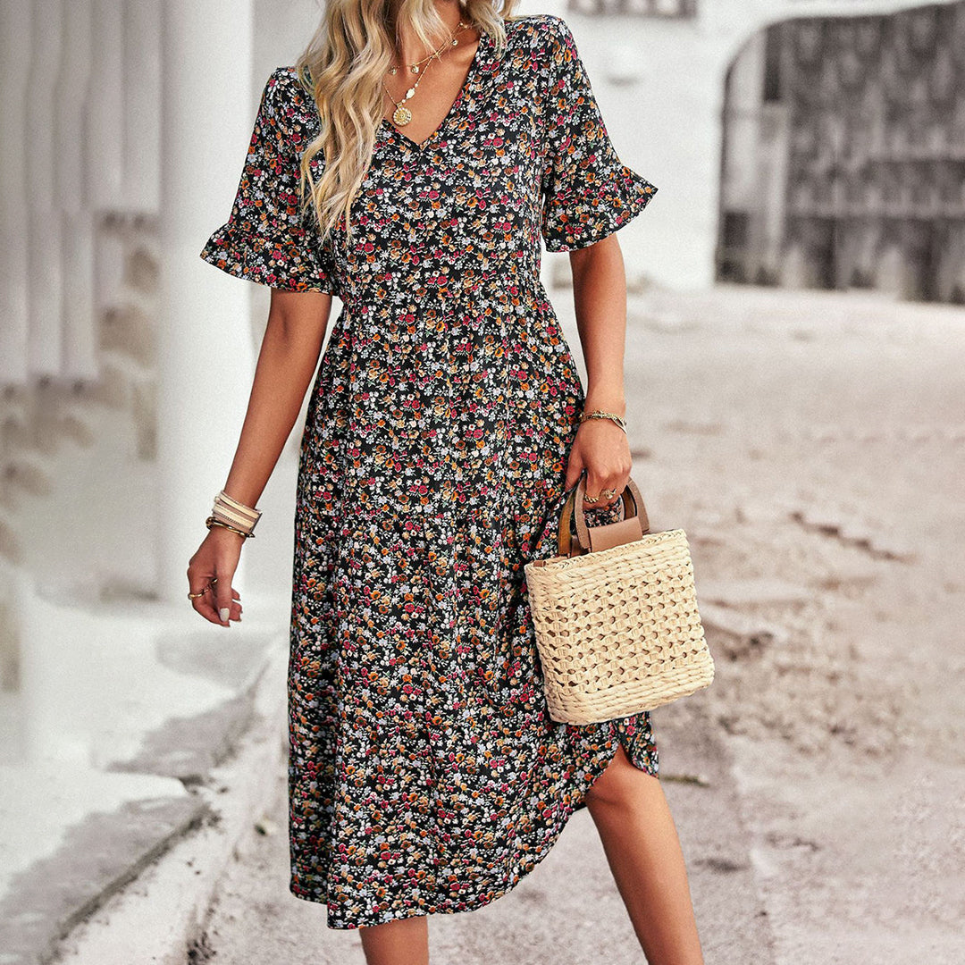 Chic floral print midi dress for women, ideal for summer casual wear, spring outings, or daytime events. V-neck style.