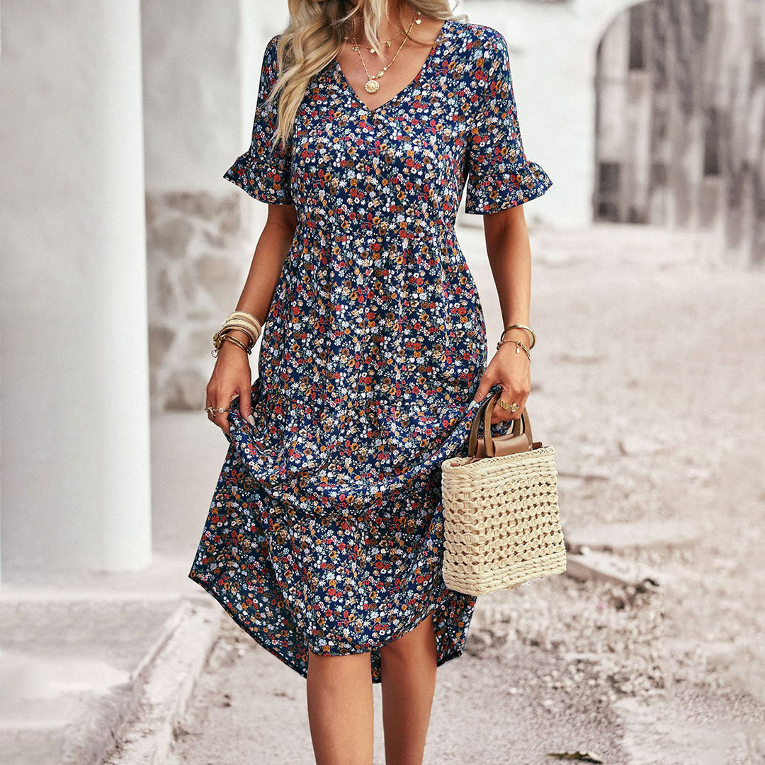 Women's elegant floral midi summer dress with V-neck, short sleeves. Perfect chic vacation or party outfit.