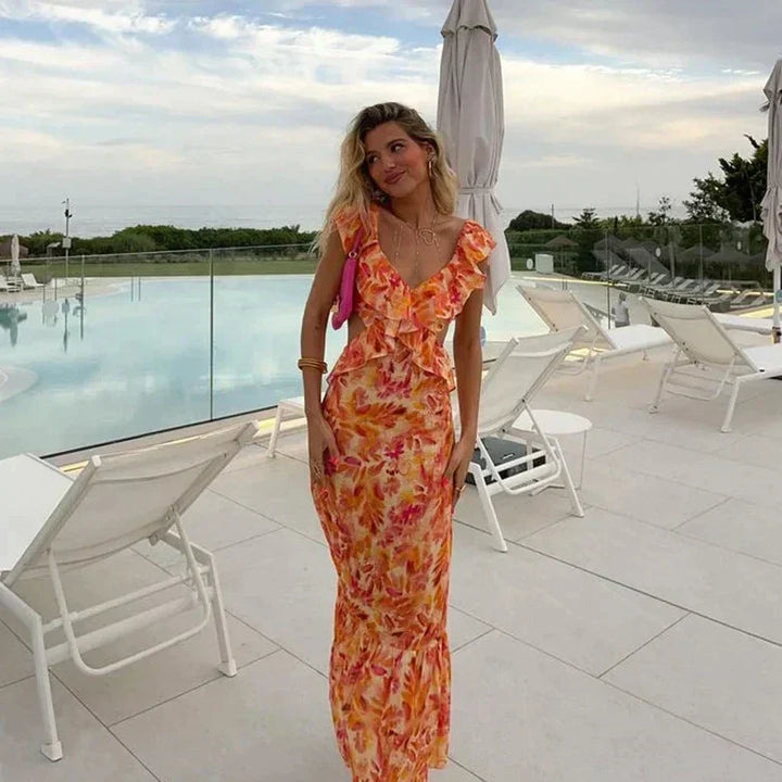 Elegant women's floral ruffled V-neck maxi dress, perfect for summer. Features a flowy design for casual or spring wear.