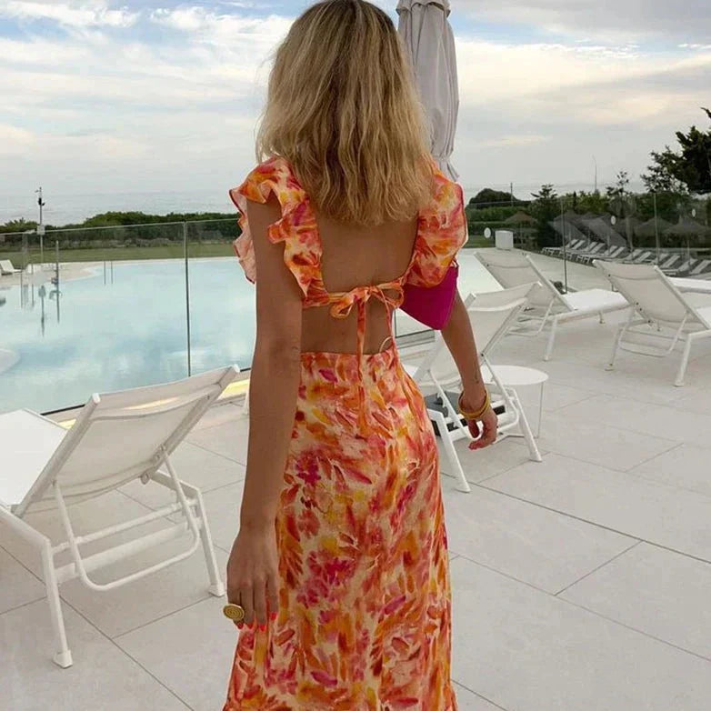 Women's vibrant floral maxi dress with elegant ruffles & a flattering V-neck, ideal for spring & summer occasions.